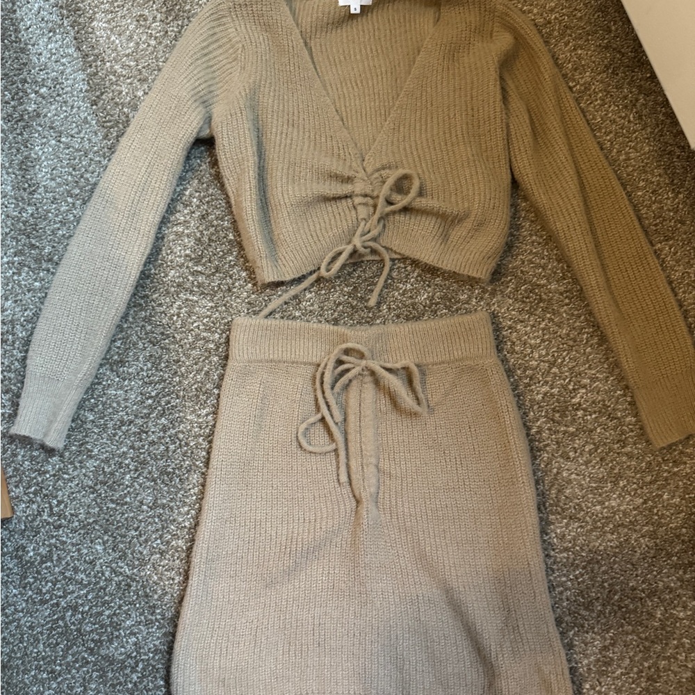 Knitted beige revolve set of skirt and top.